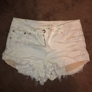Ripped white jean shorts